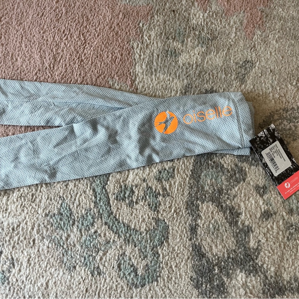 Oiselle Light Blue sleeves with Orange Logo